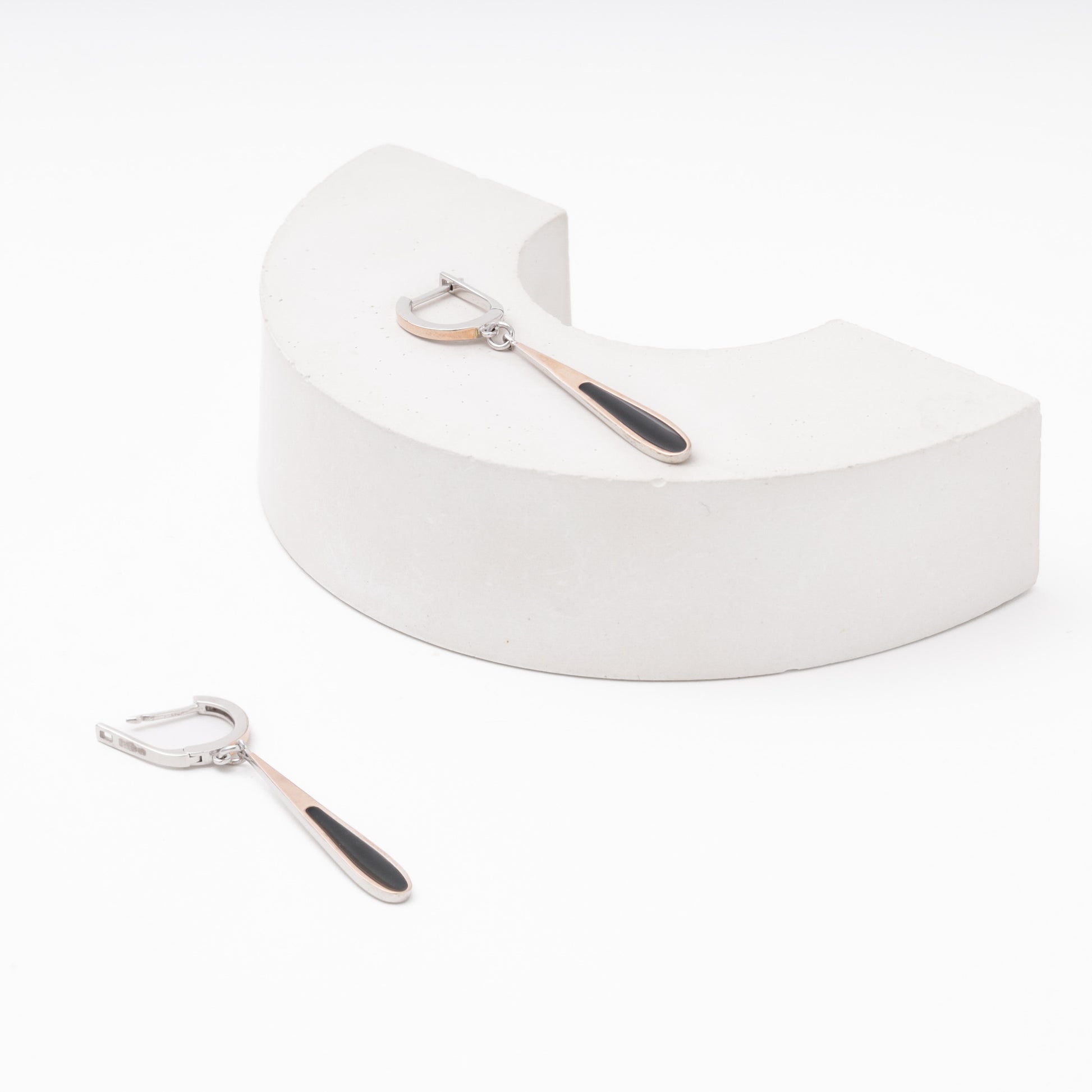 Silver drop earrings with black enamel — worn on ear — Kabluchka