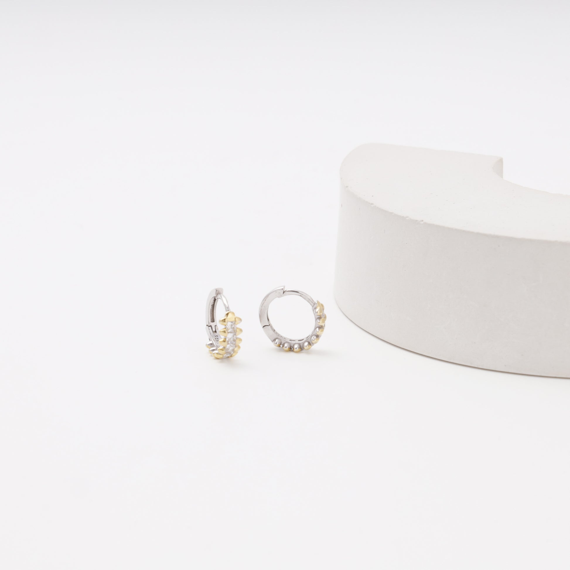 Silver 925 CZ Huggie Earrings flat lay — Kabluchka