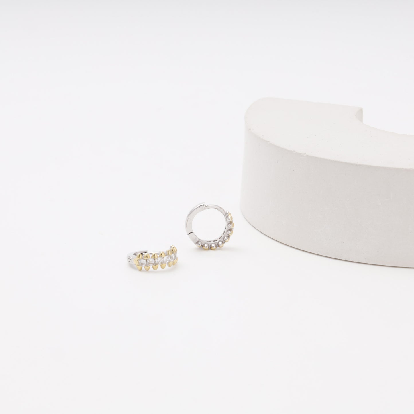 Silver 925 CZ Huggie Earrings on display — Kabluchka