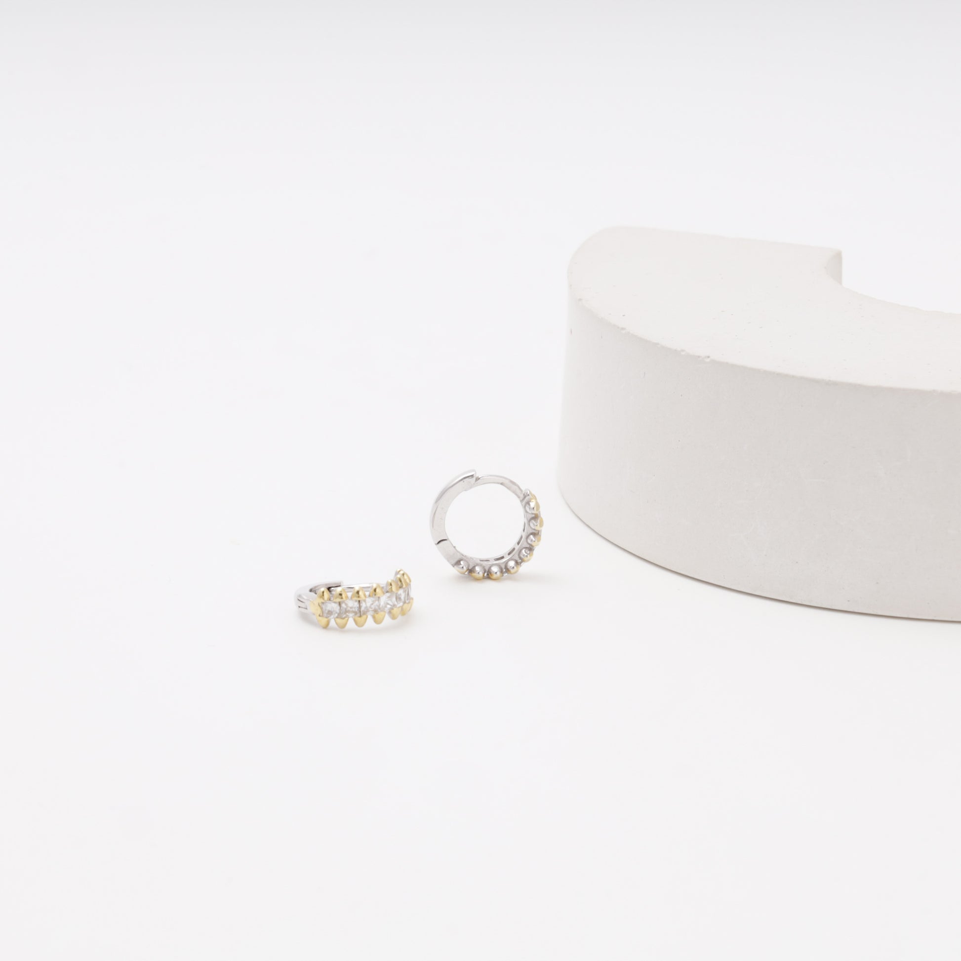 Silver 925 CZ Huggie Earrings on display — Kabluchka