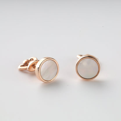 A pair of 14K (585) Rose Gold stud earrings with a secure threaded screw-back mechanism. Each earring holds a shimmering round mother-of-pearl stone in a warm gold frame, displayed on a neutral white background.