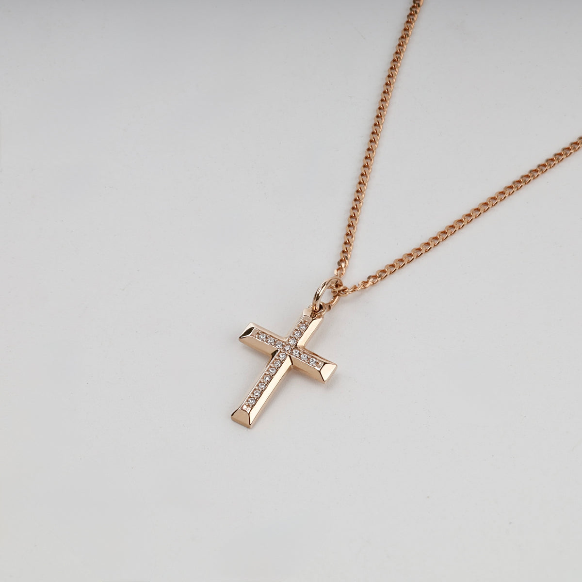 Rose gold cubic zirconia cross pendant on a styling chain — Kabluchka