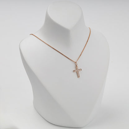 Rose gold cross pendant displayed on a necklace bust — Kabluchka