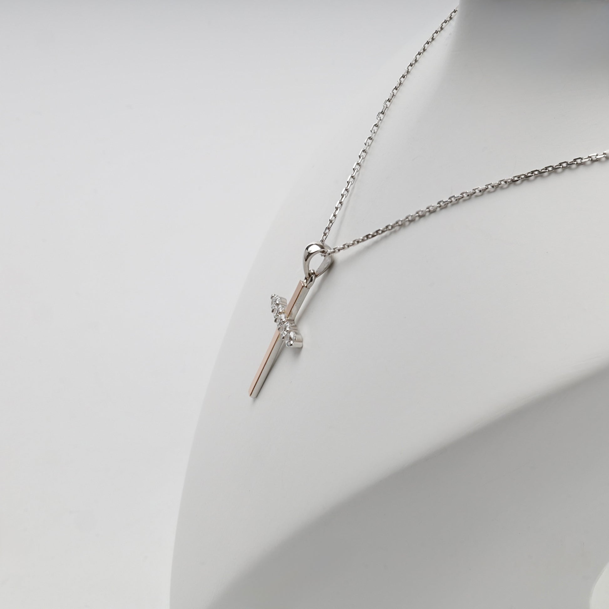 Rhodium-plated Silver 925 and Gold 375 cubic zirconia cross pendant — display view — Kabluchka