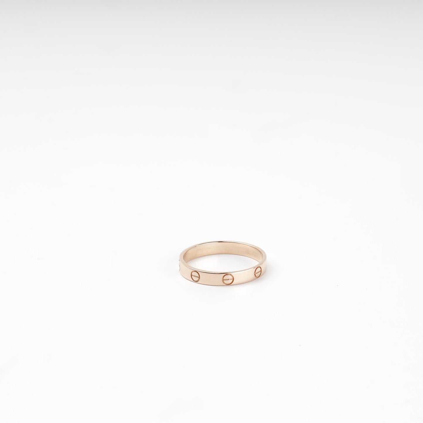 Rose gold 585 screw-motif band ring, flat view — Kabluchka