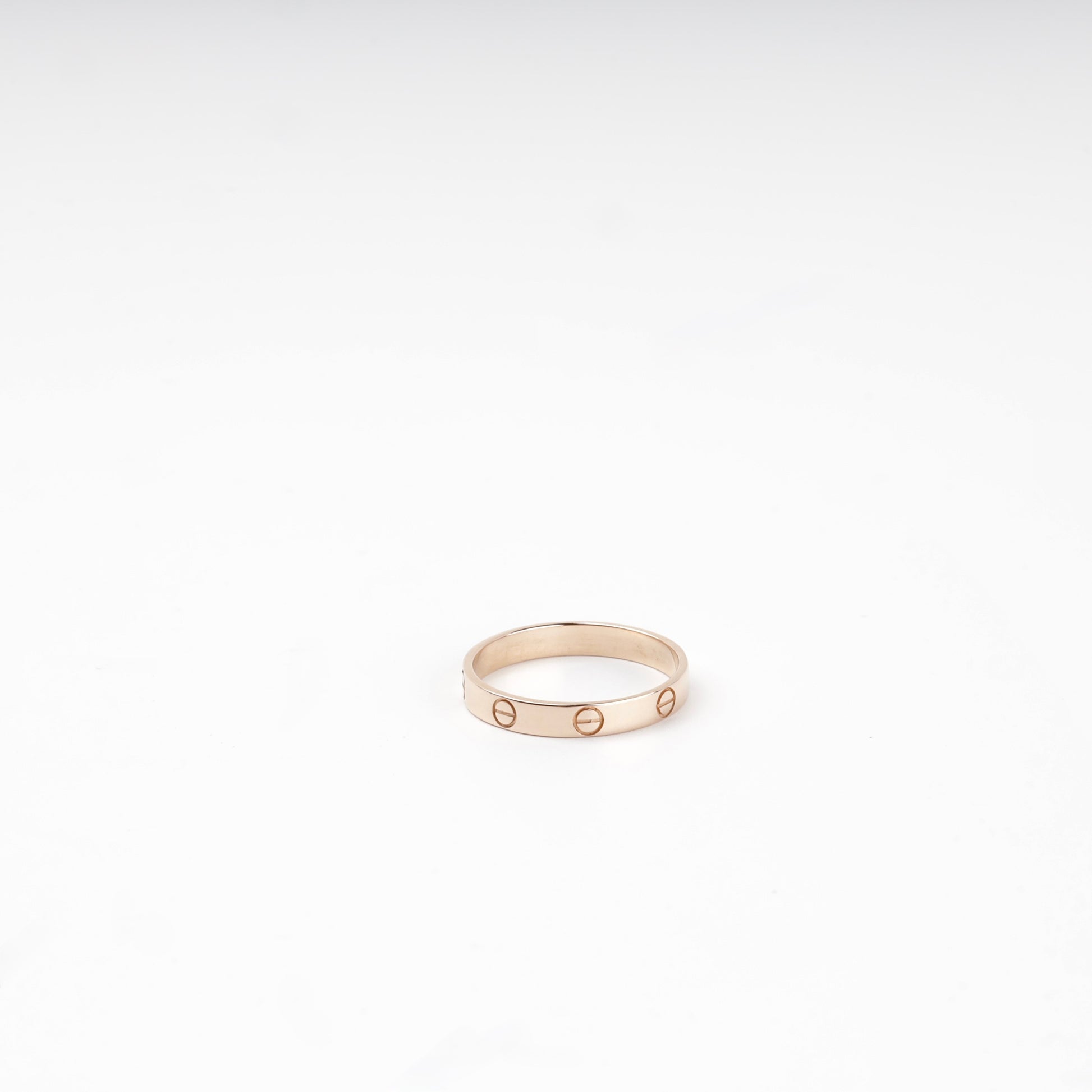 Rose gold 585 screw-motif band ring, flat view — Kabluchka