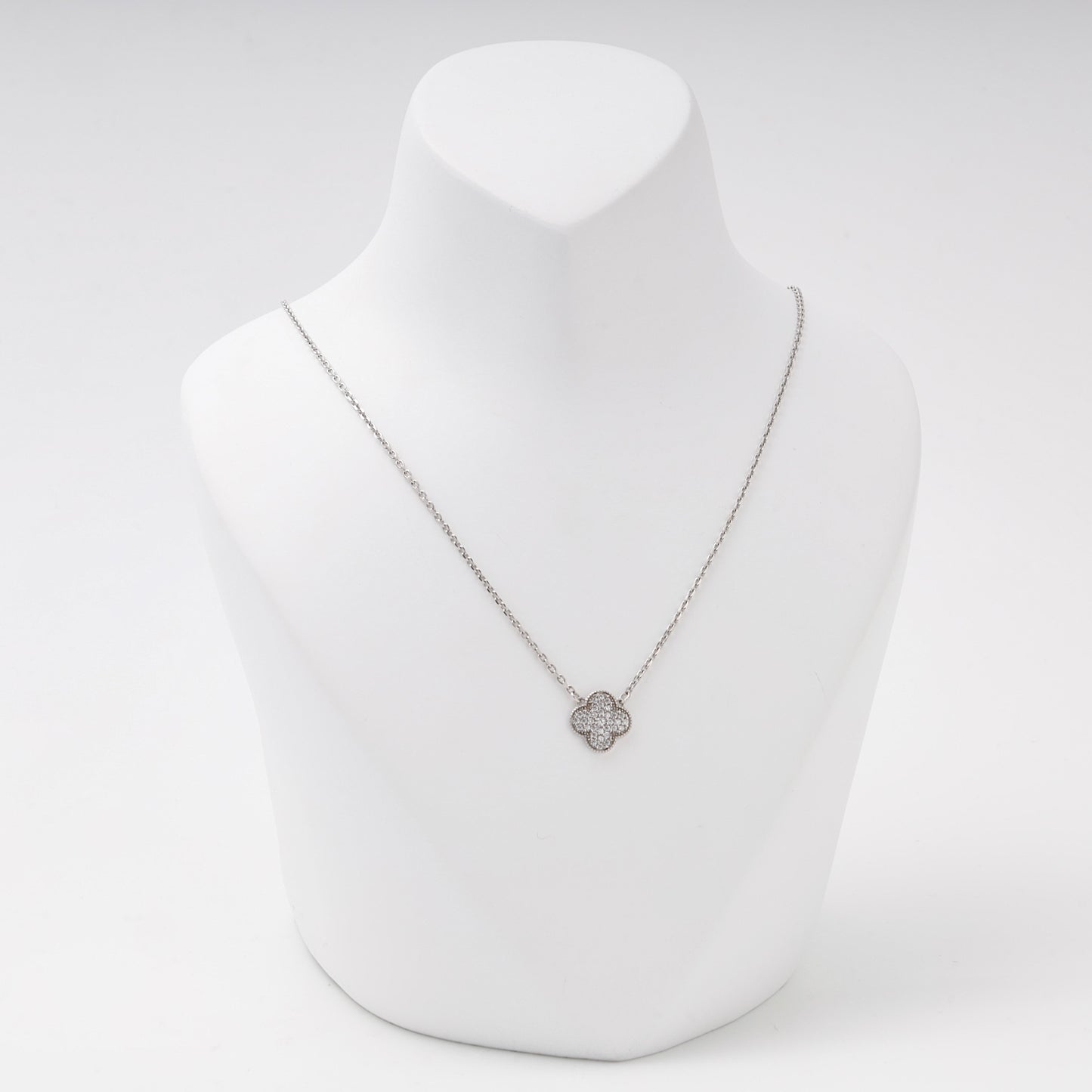 Silver 925 clover pendant necklace with cubic zirconia on a bust — Kabluchka