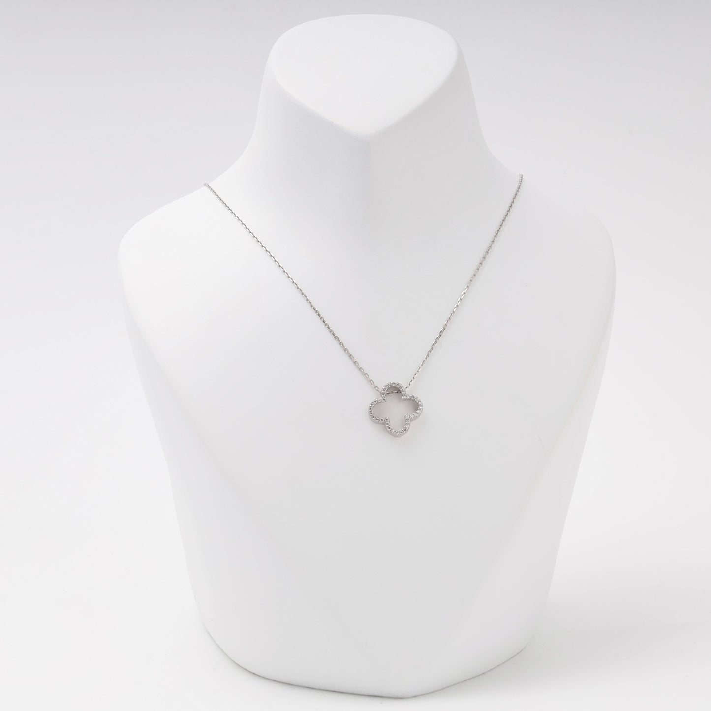 Silver 925 open clover pendant necklace with cubic zirconia on a bust — Kabluchka
