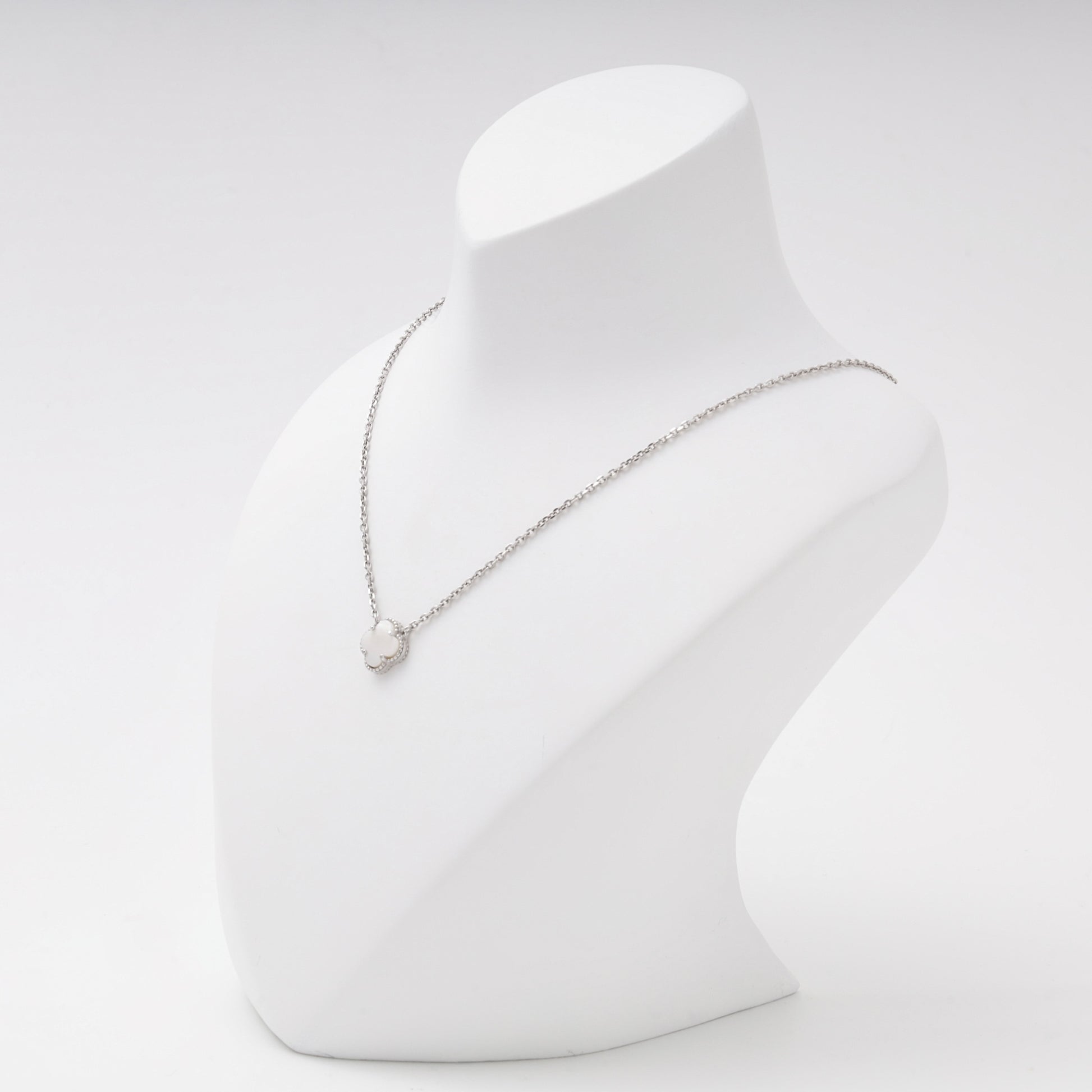 Silver 925 clover pendant necklace shown on a bust — Kabluchka
