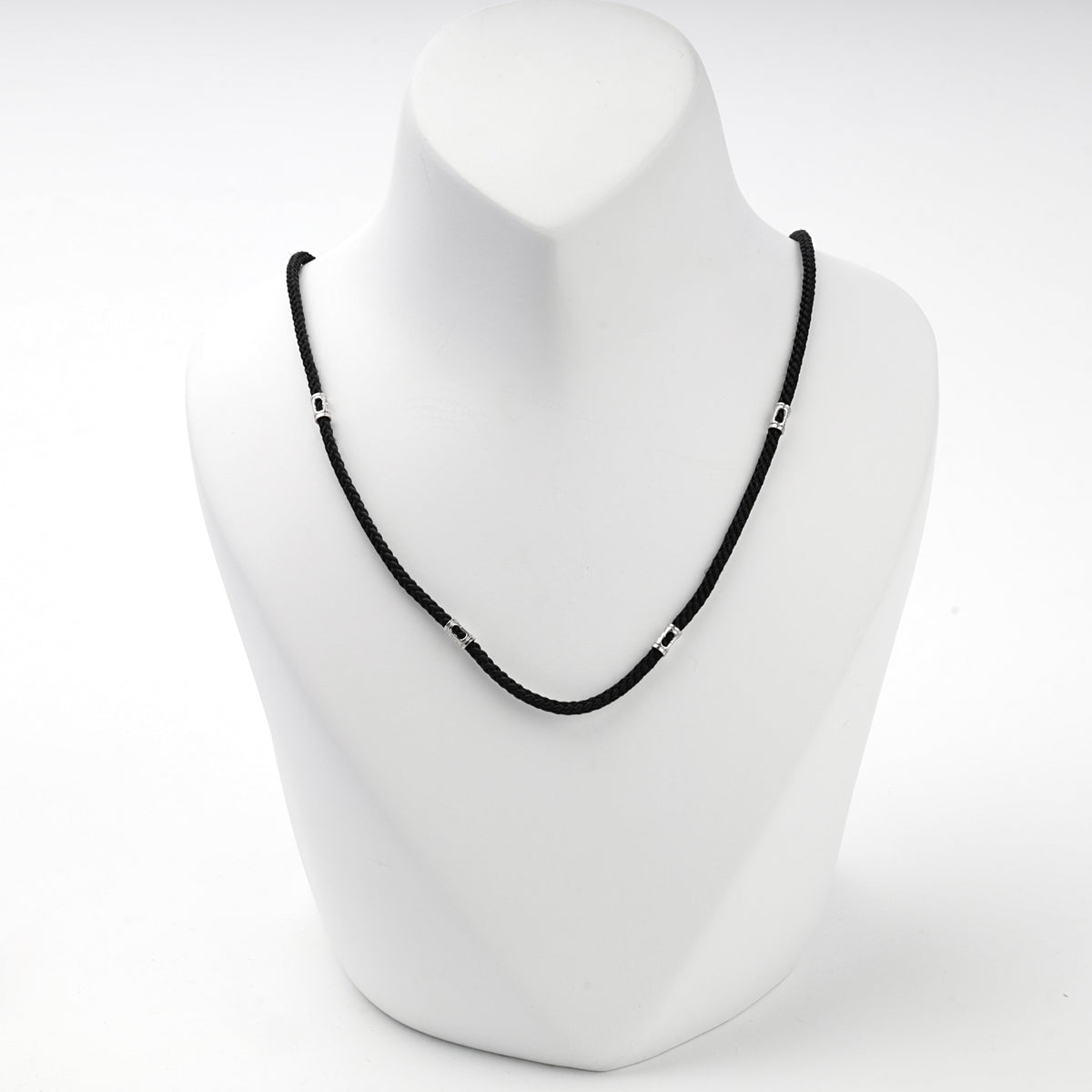Black braided cord necklace with silver 925 spacer beads, front view