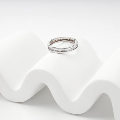 Polished white gold ring with continuous cubic zirconia row
