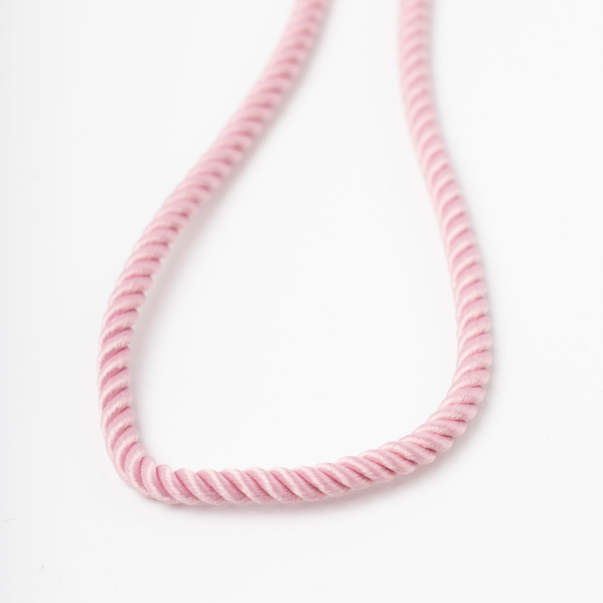 Sophisticated product - a pastel pink twisted silk cord necklace displayed on a white bust, 14K (585) Rose Gold lobster clasp and 585 hallmark.