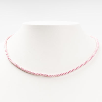 Sophisticated product - a pastel pink twisted silk cord necklace displayed on a white bust, 14K (585) Rose Gold lobster clasp and 585 hallmark.