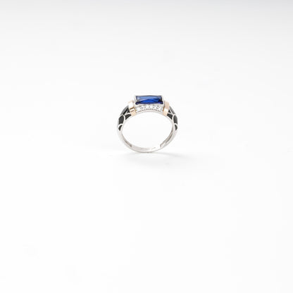 Silver and Gold 375 blue alpinite ring, angled view