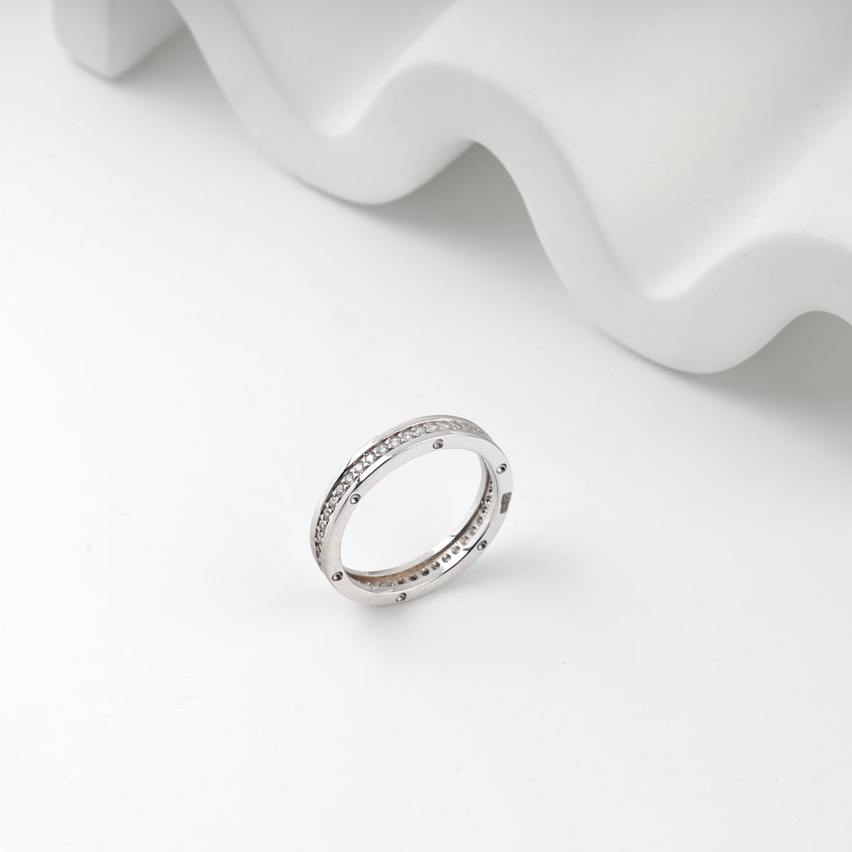 White gold channel ring circular accent side view