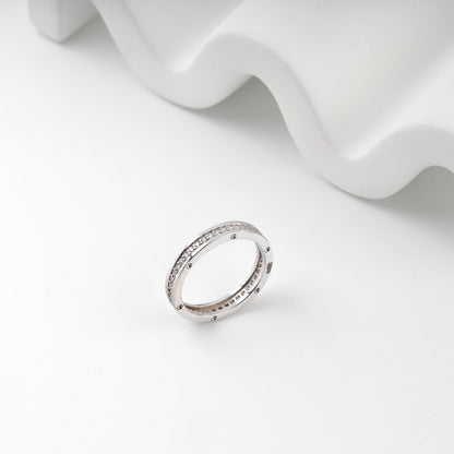White gold channel ring circular accent side view