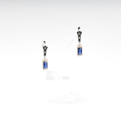 Silver and Gold 375 blue alpinite earrings, angled view