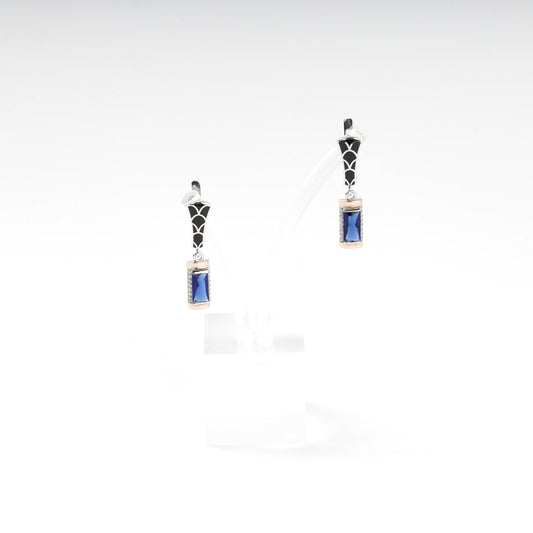 Silver and Gold 375 blue alpinite earrings, angled view