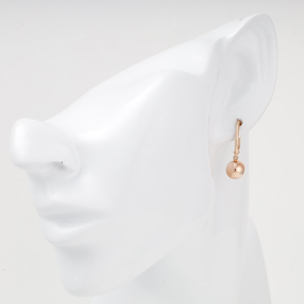 Rose gold ball drop earring shown on ear — 2005973101 — Kabluchka
