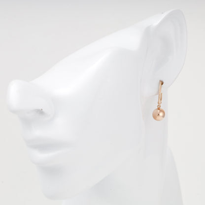 Rose gold ball drop earring shown on ear — 2005973101 — Kabluchka
