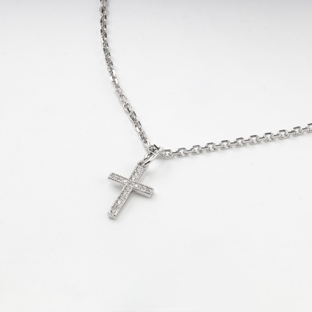Silver 925 cross pendant with clear cubic zirconia, front view