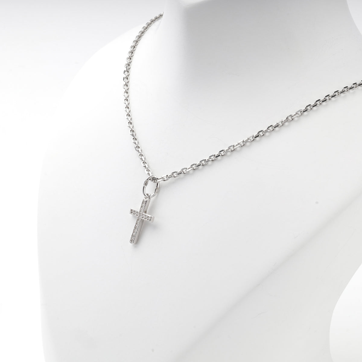 Silver 925 cross pendant with clear cubic zirconia, side view