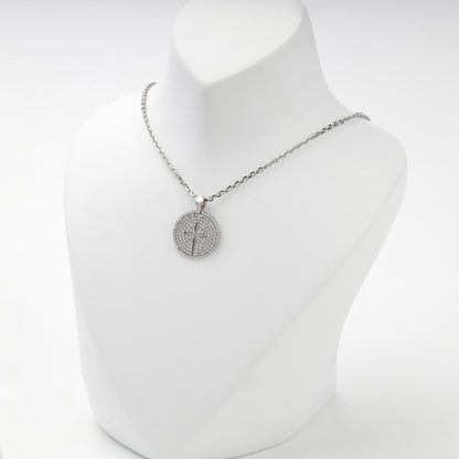 Rhodium-plated silver 925 round cross pendant with clear cubic zirconia, side view