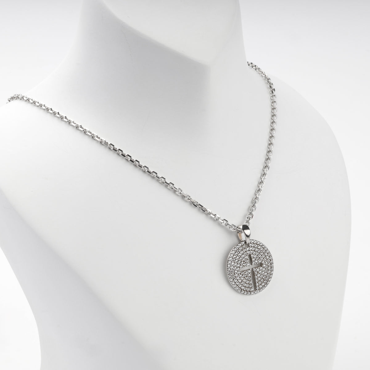 Rhodium-plated silver 925 round cross pendant with clear cubic zirconia, display view
