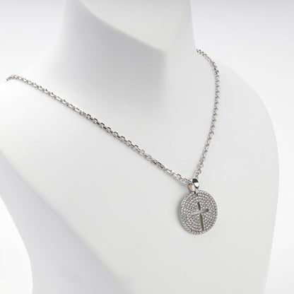 Rhodium-plated silver 925 round cross pendant with clear cubic zirconia, display view