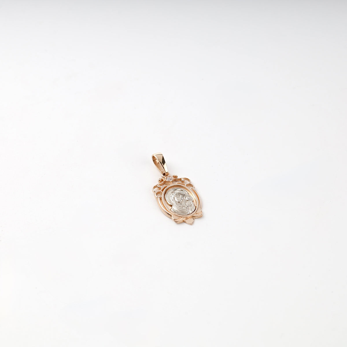 Two-tone gold cubic zirconia religious pendant, front view