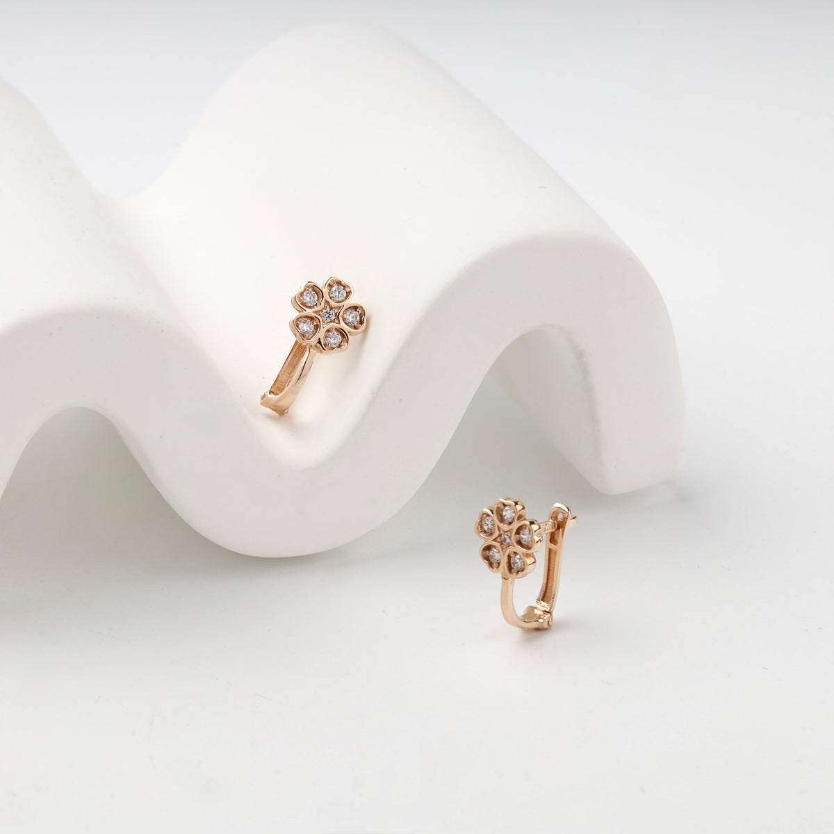 Children's rose gold flower earrings — angled view — Kabluchka