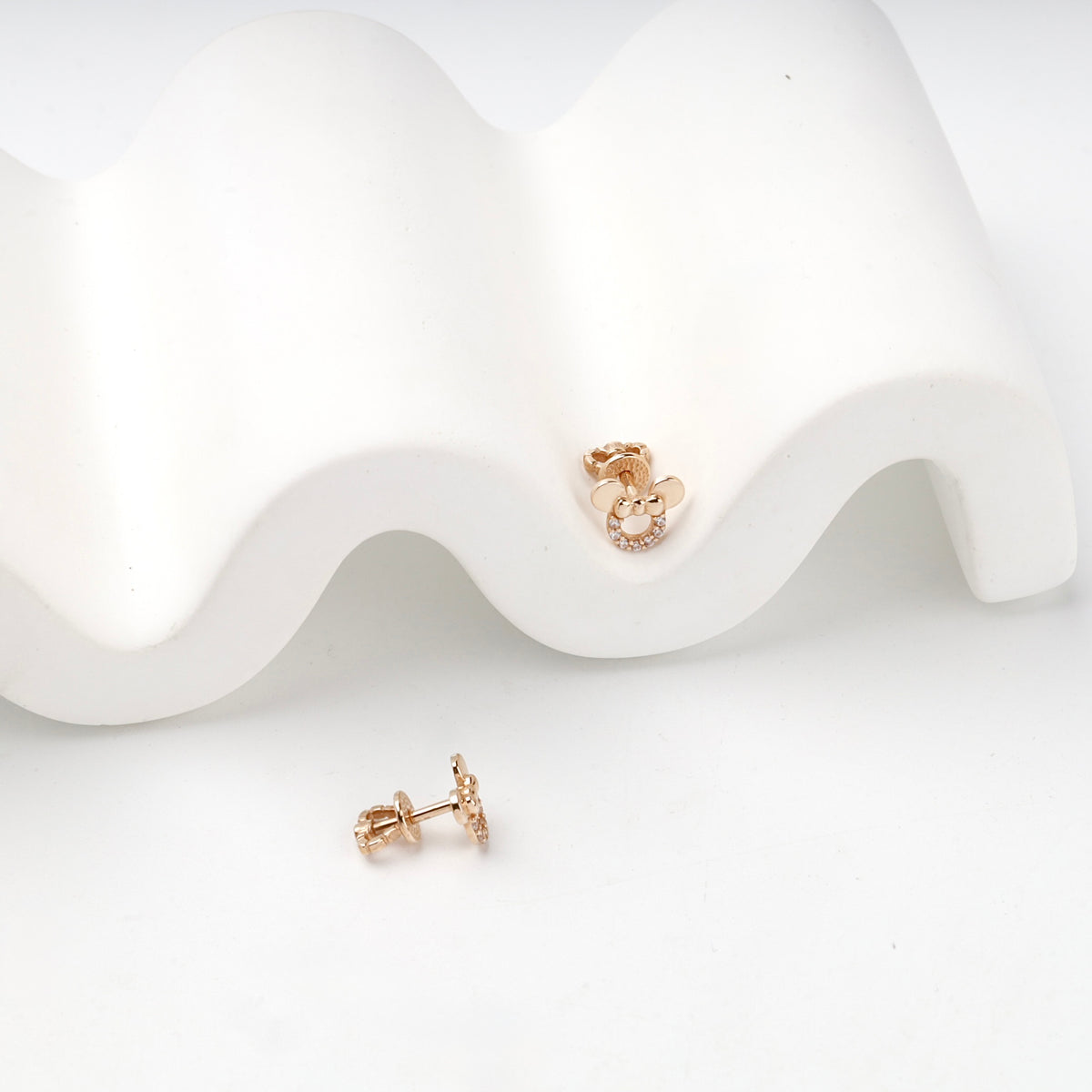 Rose Gold 14K (585) Cubic Zirconia Bow Stud Earrings — angled view — Kabluchka