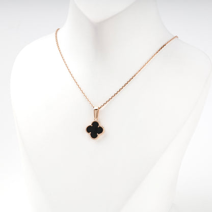 Black onyx clover pendant styled on a chain — Kabluchka