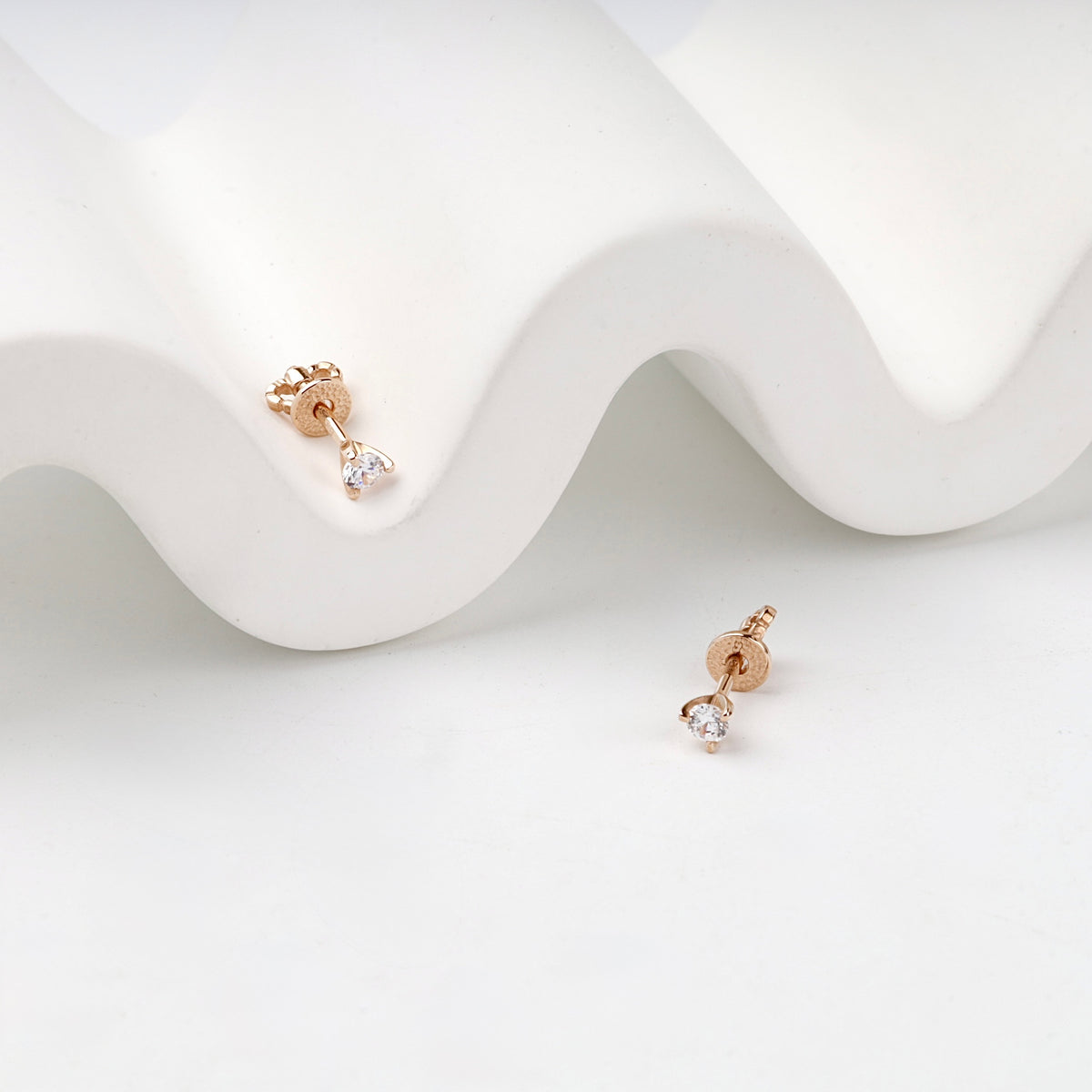Rose Gold 14K (585) Cubic Zirconia Solitaire Stud Earrings — angled view — Kabluchka