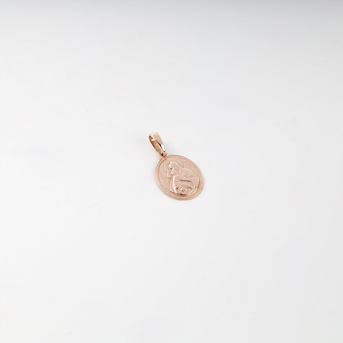 Polished rose gold Virgin Mary and Child pendant, front view