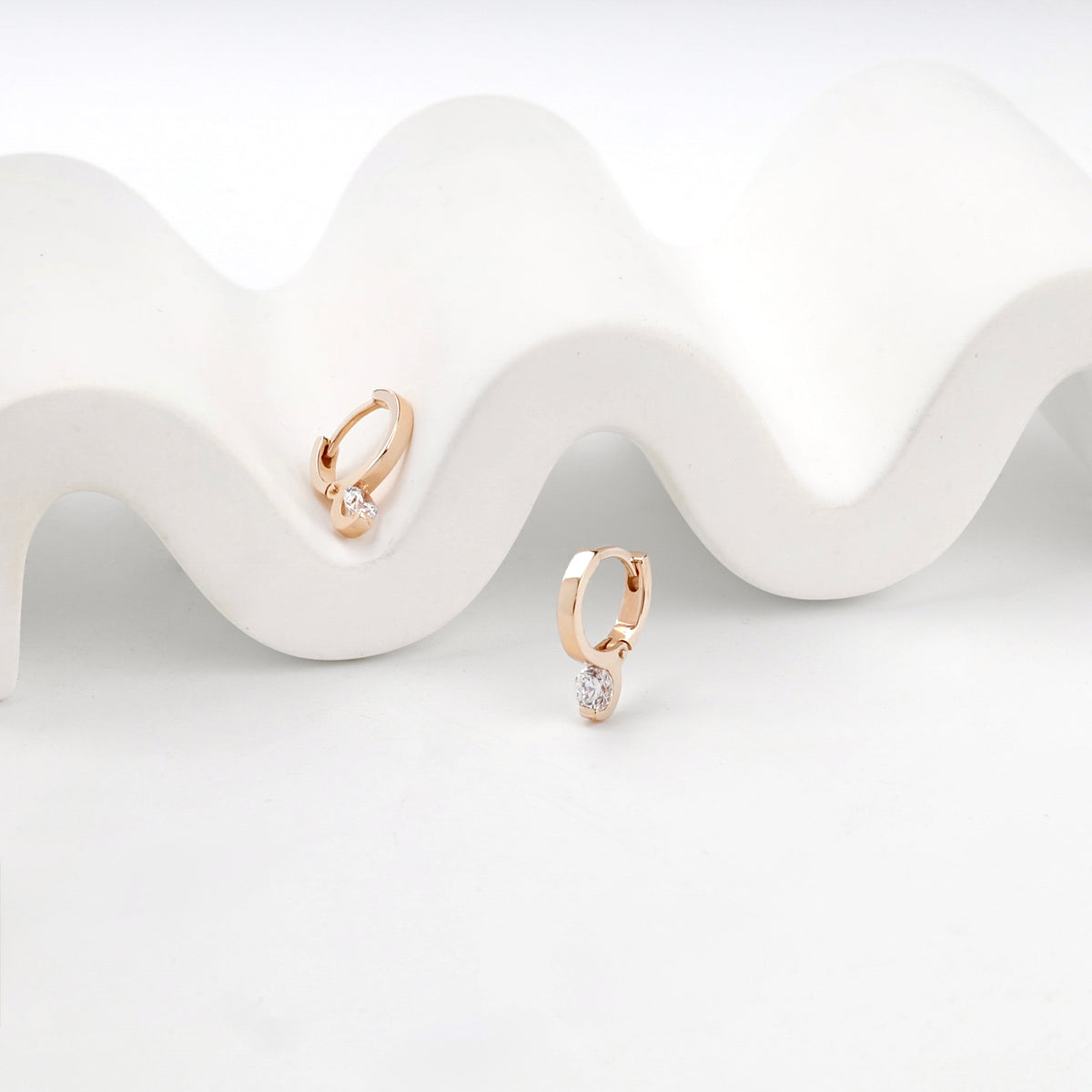 Rose Gold 14K (585) Royal Cubic Zirconia Huggie Earrings — angled view — Kabluchka