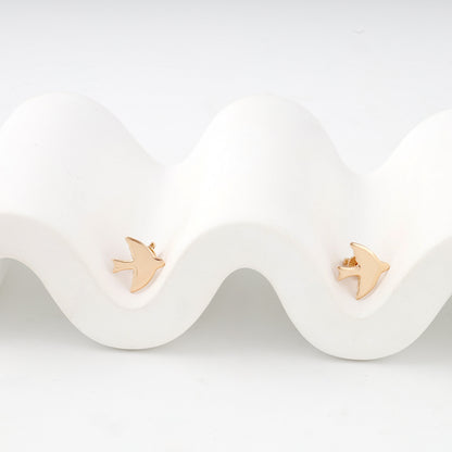 Rose gold polished bird stud earrings — front view — Kabluchka