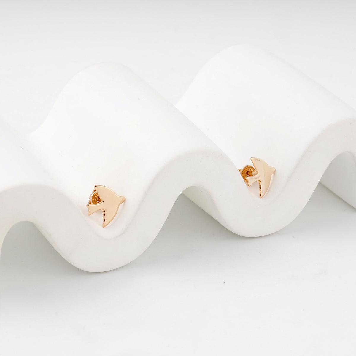 Polished bird stud earrings in rose gold — pair view — Kabluchka