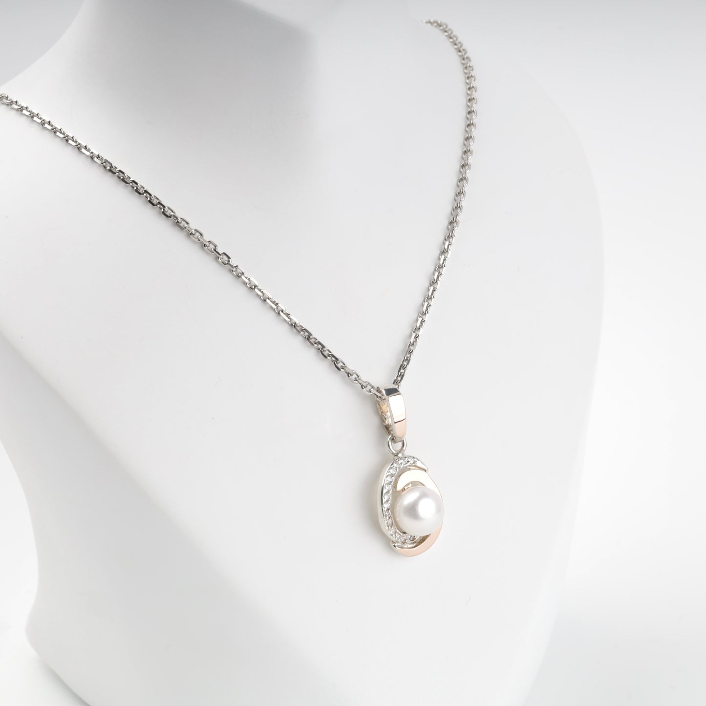 Two-tone pearl pendant shown on chain — front detail — Kabluchka