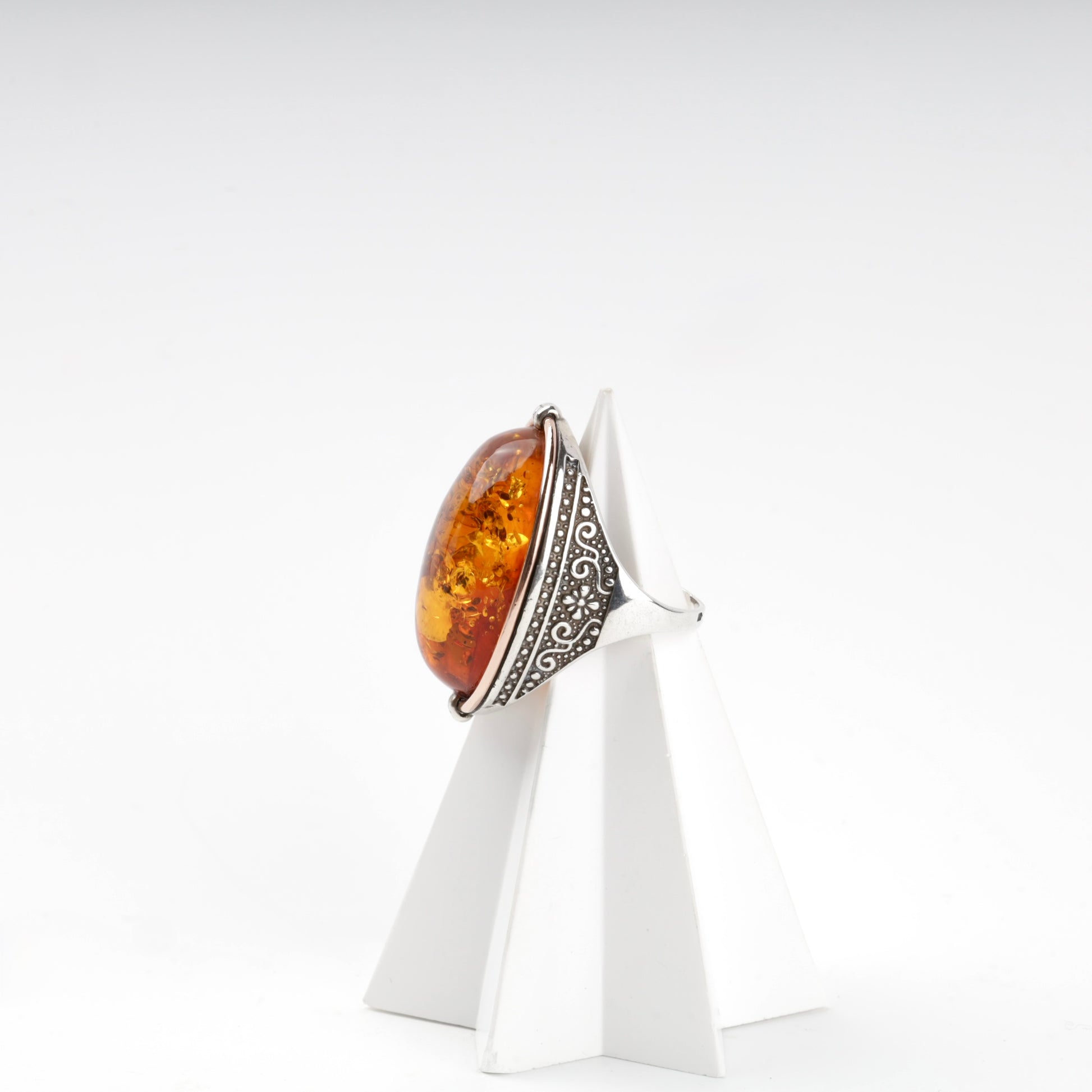 Amber ring with scrolling silver shoulders and gold accent — Kabluchka