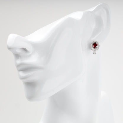 Red cubic zirconia halo earring shown on ear — Kabluchka
