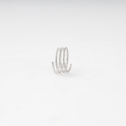 Layered open ring with diamond-cut texture — close-up — Kabluchka
