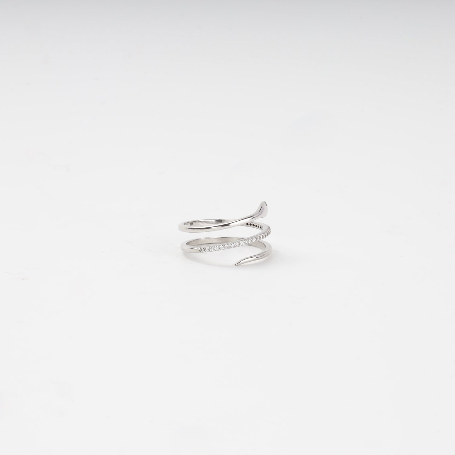 Silver snake ring showing the tapering tail and cubic zirconia coil — Kabluchka