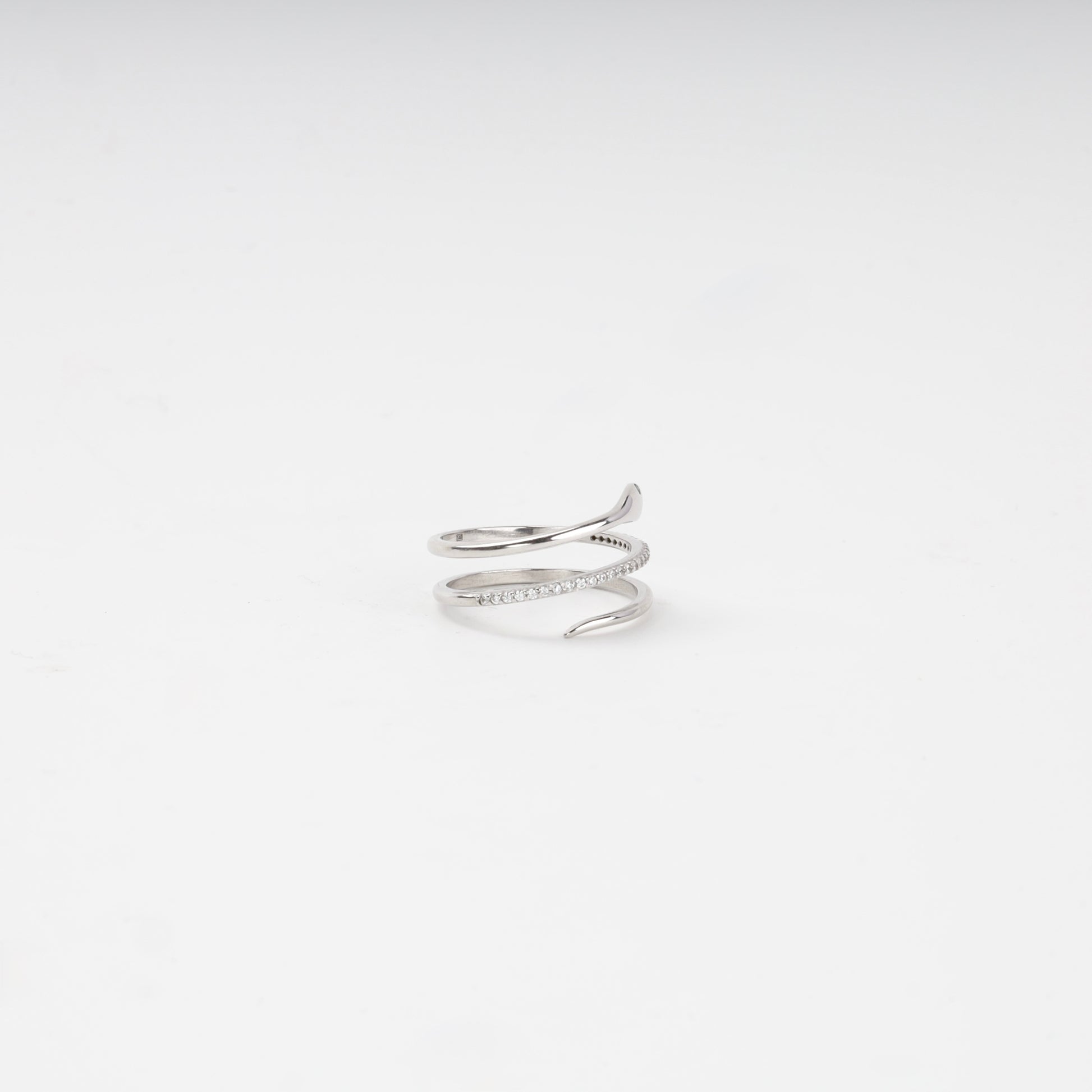 Silver snake ring showing the tapering tail and cubic zirconia coil — Kabluchka