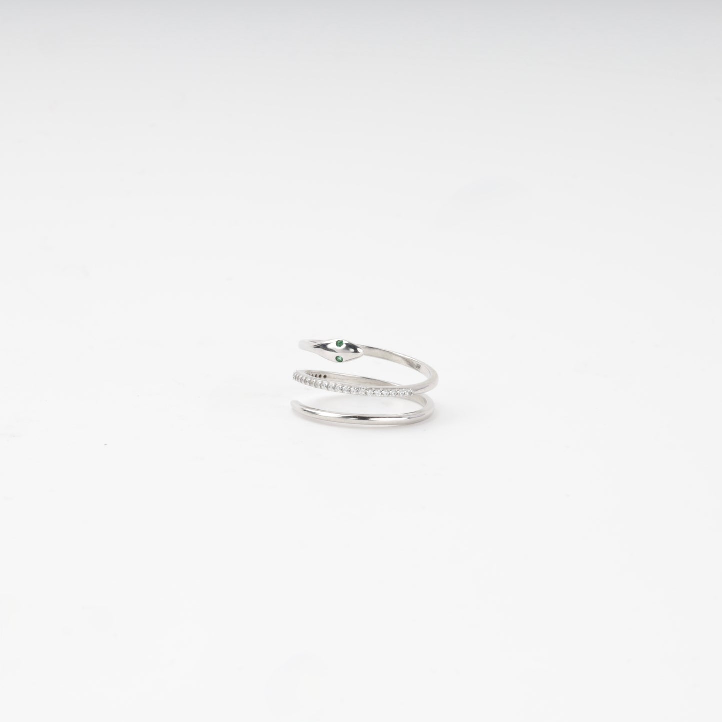 Snake ring head with green cubic zirconia eyes, side view — Kabluchka
