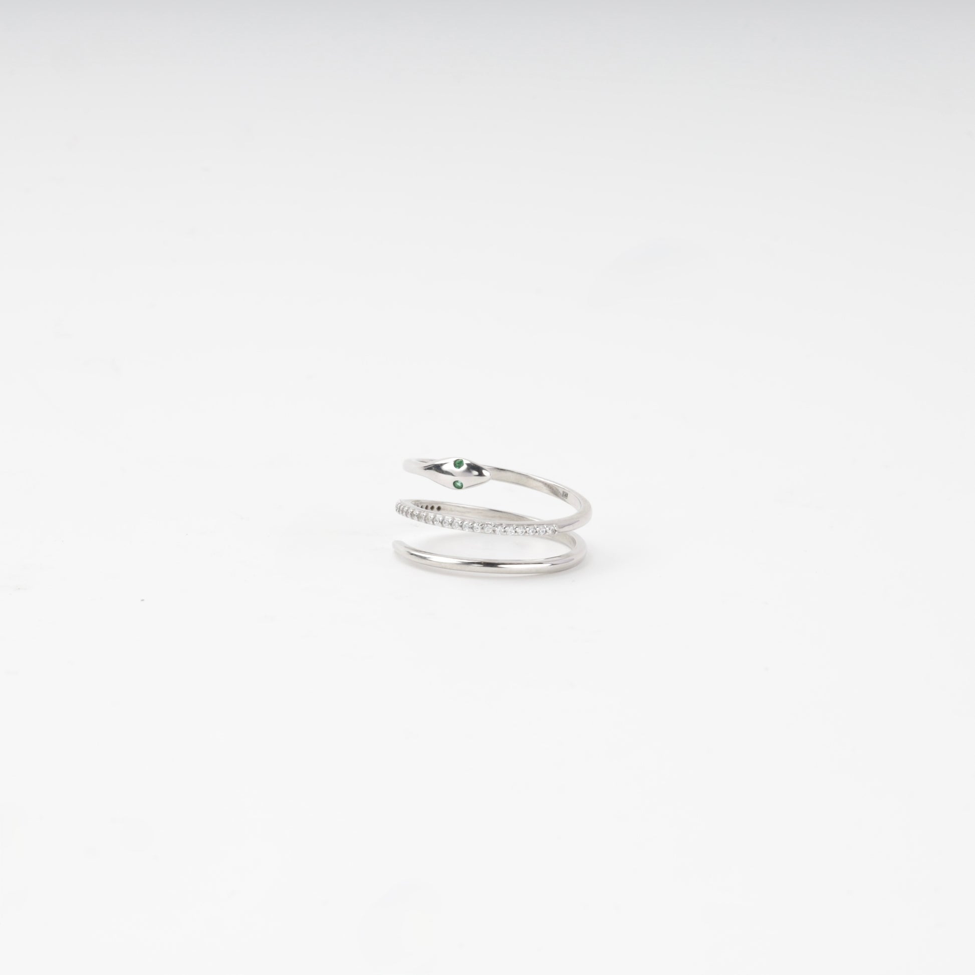 Snake ring head with green cubic zirconia eyes, side view — Kabluchka