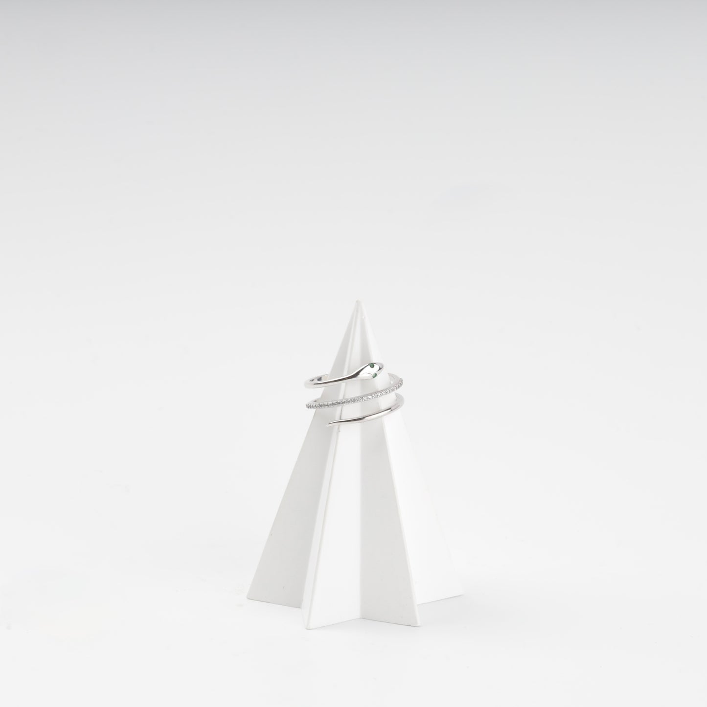 Silver 925 snake wrap ring on a stand, front view — Kabluchka