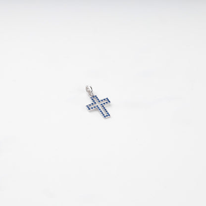 Rhodium-plated silver 925 cross pendant with blue cubic zirconia, detail view