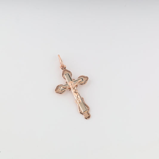 585 rose gold cross on a light gray background