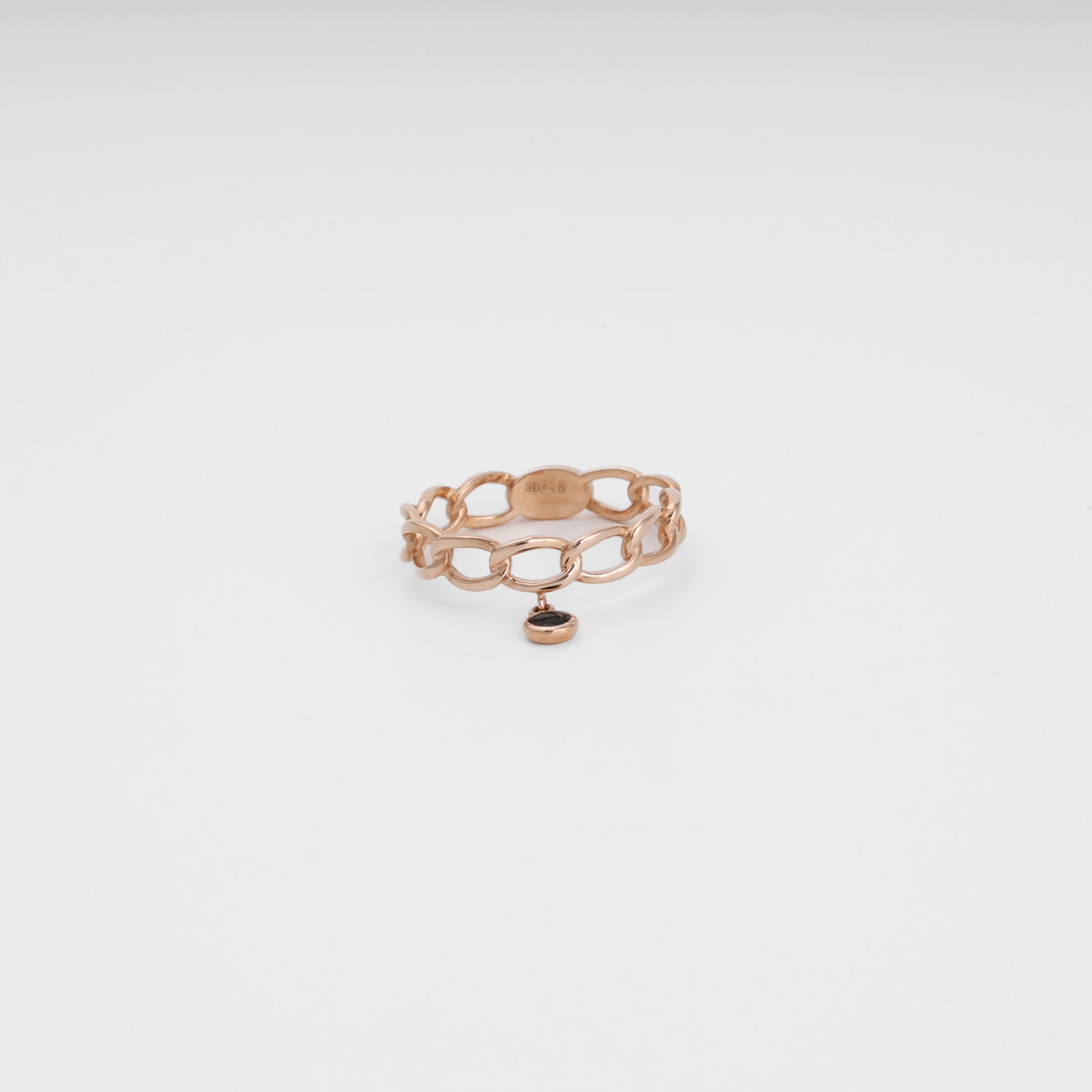 Rose gold chain ring with black charm angled view showing hallmark - Kabluchka